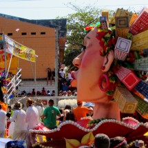 Float with skyscrapers on a Lady's head